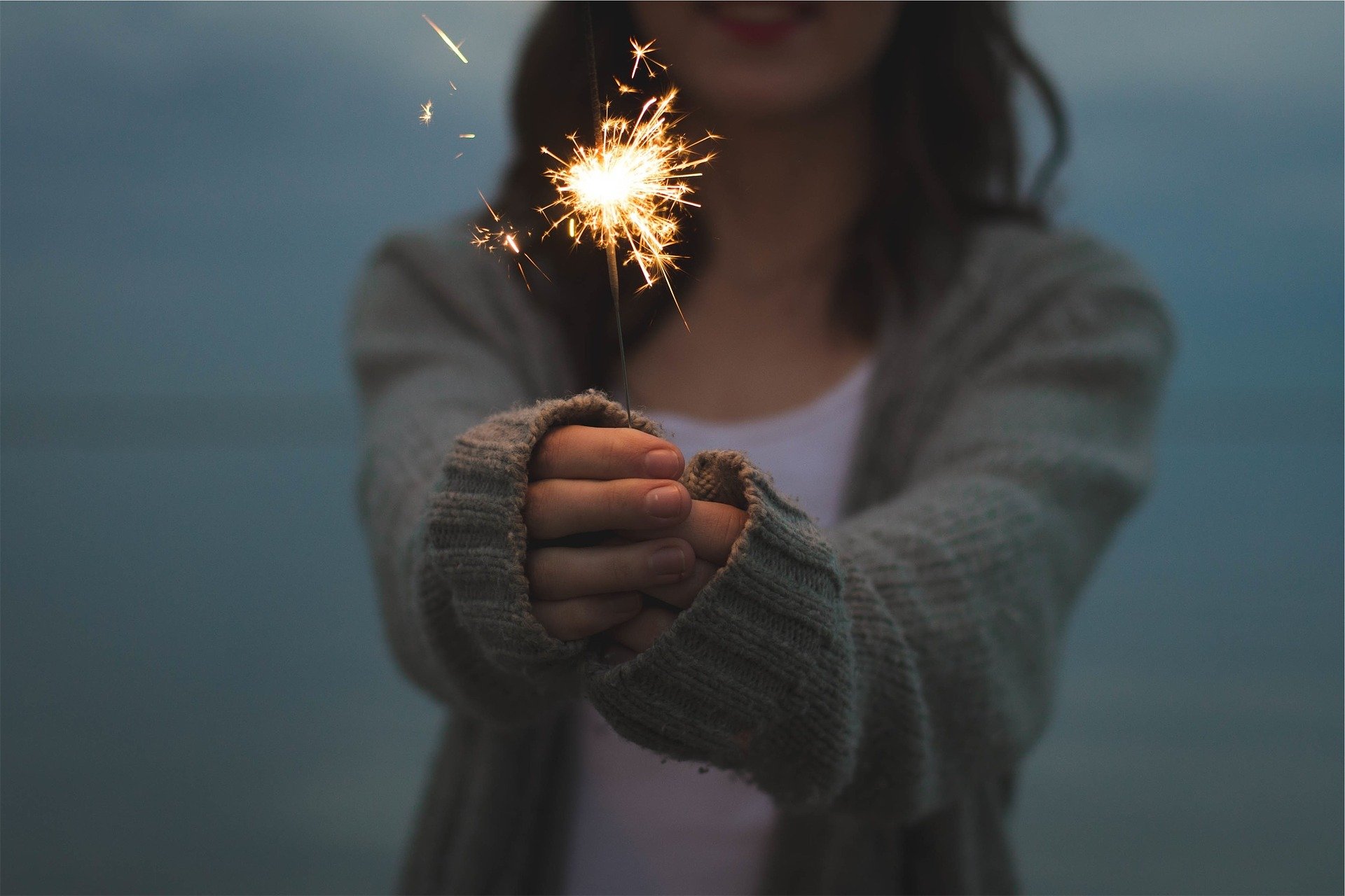 women holding sparkler adhd and women